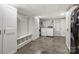 Functional laundry area with washer, dryer, storage cabinets, and convenient bench seating at 9025 Shields Dr, Huntersville, NC 28078