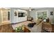 Inviting living room with a sectional sofa, hardwood floors, and sliding door access to the backyard at 9025 Shields Dr, Huntersville, NC 28078