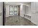 Well-organized mud room with storage cabinets, bench, hooks and access to the backyard at 9025 Shields Dr, Huntersville, NC 28078