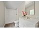 Bright bathroom with white vanity, toilet, and shower with a window view at 102 Lansdale Ave, Lincolnton, NC 28092