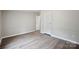 Bedroom featuring updated flooring, neutral paint, and two closets at 102 Lansdale Ave, Lincolnton, NC 28092