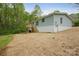 Exterior of home with wooden deck and stairs leading to backyard with ground cover at 102 Lansdale Ave, Lincolnton, NC 28092