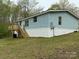 Exterior view of the house with a wooden deck and stairs at 102 Lansdale Ave, Lincolnton, NC 28092