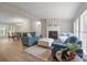 Inviting living room with hardwood floors, fireplace, and comfortable blue sofas, perfect for relaxation and entertaining at 102 Lansdale Ave, Lincolnton, NC 28092