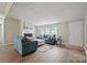 Inviting living room with hardwood floors, fireplace, and comfortable blue sofas, perfect for relaxation and entertaining at 102 Lansdale Ave, Lincolnton, NC 28092