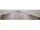 Room displaying light wood flooring and neutral color walls, with bright white trim at 102 Lansdale Ave, Lincolnton, NC 28092