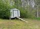 A white shed with a ramp in the backyard at 102 Lansdale Ave, Lincolnton, NC 28092