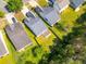 Aerial view of residences with lush greenery and private backyard, creating a peaceful retreat at 10441 Hugue Way, Charlotte, NC 28214