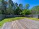 Picture of the backyard featuring a wooden deck and green grass at 10441 Hugue Way, Charlotte, NC 28214