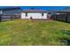 Picture of the backyard featuring a small deck and green grass at 10441 Hugue Way, Charlotte, NC 28214