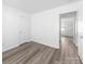 This bedroom is bright with fresh paint and new laminate flooring at 10441 Hugue Way, Charlotte, NC 28214