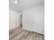 This bedroom features neutral walls, updated floors, and a large closet at 10441 Hugue Way, Charlotte, NC 28214