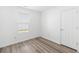 Bedroom featuring new vinyl plank flooring, bright natural light and neutral walls at 10441 Hugue Way, Charlotte, NC 28214