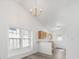 Bright dining area showcasing vaulted ceilings, chandelier lighting, and a view of the kitchen at 10441 Hugue Way, Charlotte, NC 28214