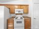 Kitchen features light wood cabinets and white appliances at 10441 Hugue Way, Charlotte, NC 28214
