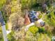 Aerial view of a private residence surrounded by lush greenery and a winding driveway at 106 Berea Baptist Church Rd, Stanfield, NC 28163