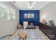 Bright Bedroom with a crib, soft rug, and natural light at 106 Berea Baptist Church Rd, Stanfield, NC 28163