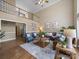 Spacious living room featuring high ceilings, ample natural light, a ceiling fan, and a view of the loft at 106 Berea Baptist Church Rd, Stanfield, NC 28163