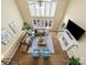 Bright living room boasts hardwood floors, fireplace, modern furniture, and large windows providing natural light at 106 Berea Baptist Church Rd, Stanfield, NC 28163