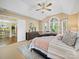 Comfortable main bedroom with a ceiling fan, arched windows, and plenty of space at 106 Berea Baptist Church Rd, Stanfield, NC 28163