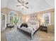Inviting main bedroom with a vaulted ceiling, ceiling fan, and an abundance of natural light at 106 Berea Baptist Church Rd, Stanfield, NC 28163