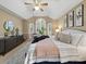 Spacious main bedroom features a vaulted ceiling, large windows, and comfortable furnishings at 106 Berea Baptist Church Rd, Stanfield, NC 28163