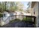 A wooden deck with a view of other buildings at 11100 Pine Grove Ave, Mint Hill, NC 28227