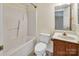 Bathroom with a shower-tub, toilet and single sink vanity at 11100 Pine Grove Ave, Mint Hill, NC 28227