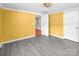 Bedroom has light-grey flooring, closet and access to another room at 11100 Pine Grove Ave, Mint Hill, NC 28227