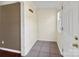 Bright entryway features ceramic tile flooring and access to coat hooks at 11100 Pine Grove Ave, Mint Hill, NC 28227