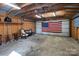 Spacious garage with overhead lighting and patriotic decor at 11100 Pine Grove Ave, Mint Hill, NC 28227