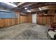 A spacious garage with overhead lighting and storage shelves at 11100 Pine Grove Ave, Mint Hill, NC 28227