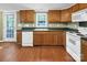 Practical kitchen with a dishwasher, ample counter space, and an exterior door at 11100 Pine Grove Ave, Mint Hill, NC 28227