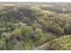 Overhead aerial view of a house surrounded by trees and open yard at 11170 Nc Hwy 73 E Hwy, Mount Pleasant, NC 28124
