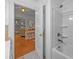 Bathroom showcasing a tub/shower combo, open doorway, and a view of the living area enhancing its appeal at 11170 Nc Hwy 73 E Hwy, Mount Pleasant, NC 28124