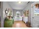 Bright bedroom with a daybed, plants, and vintage-style dressers offering a peaceful and organized space at 11170 Nc Hwy 73 E Hwy, Mount Pleasant, NC 28124