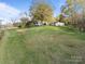 Expansive lawn and charming single-story house and garage, perfect for outdoor activities and serene country living at 11170 Nc Hwy 73 E Hwy, Mount Pleasant, NC 28124