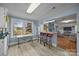 Bright kitchen featuring breakfast bar, opening up to the living room and view to the backyard at 11170 Nc Hwy 73 E Hwy, Mount Pleasant, NC 28124