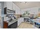 Bright kitchen with stainless steel appliances, and a view to the living room at 11170 Nc Hwy 73 E Hwy, Mount Pleasant, NC 28124