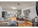 Bright living room with hardwood floors, a brick fireplace, and an open view to the kitchen at 11170 Nc Hwy 73 E Hwy, Mount Pleasant, NC 28124