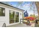 Inviting back deck with a sliding glass door and South Carolina flag overlooking a landscaped yard at 1162 Westover Cir, Rock Hill, SC 29732