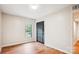 Empty bedroom with window, dark closet, wood-look flooring, and neutral paint at 1162 Westover Cir, Rock Hill, SC 29732