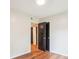 Bright bedroom features sleek dark doors and hardwood floors, creating a modern feel at 1162 Westover Cir, Rock Hill, SC 29732