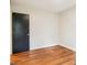 Empty bedroom with a dark door and wood-look flooring at 1162 Westover Cir, Rock Hill, SC 29732