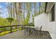 Inviting outdoor deck with a table and chairs, perfect for relaxing and enjoying the surrounding scenery at 1162 Westover Cir, Rock Hill, SC 29732