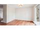 Dining area featuring hardwood floors, large windows, and a brick wall at 1162 Westover Cir, Rock Hill, SC 29732