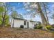 Back exterior view of the house showing an outdoor living area and lush landscaping at 1162 Westover Cir, Rock Hill, SC 29732