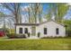 Charming white brick home with a well-manicured lawn and lush landscaping at 1162 Westover Cir, Rock Hill, SC 29732