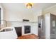 Bright kitchen featuring white cabinetry, modern appliances, and wood-look flooring at 1162 Westover Cir, Rock Hill, SC 29732