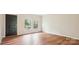 Bright living room featuring hardwood floors and two windows with views of outside at 1162 Westover Cir, Rock Hill, SC 29732